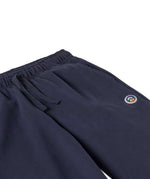 A close up of the waistband on the Patagonia Kids Sweatpants in a Fitz Roy Icon New Navy colour way.