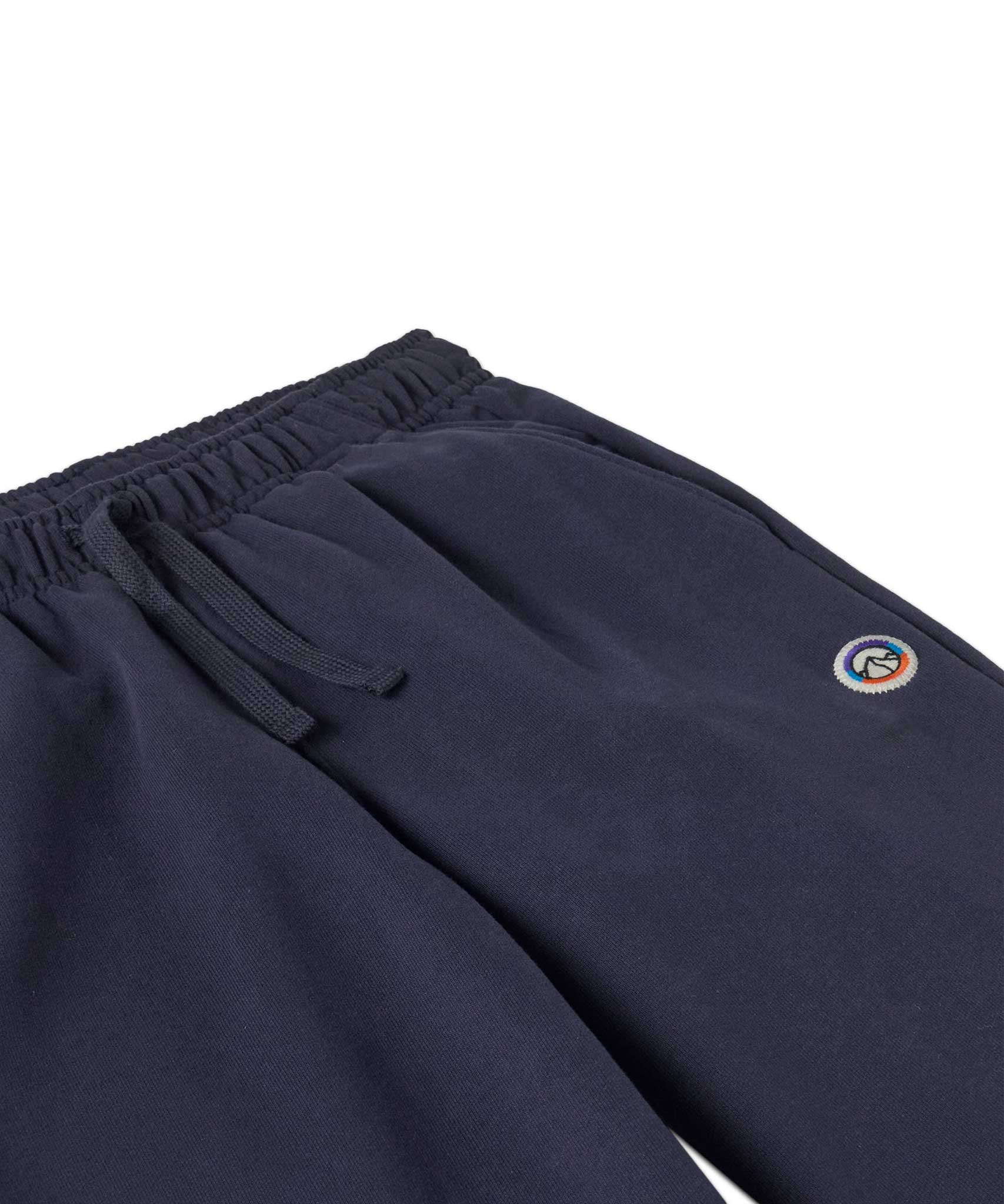 A close up of the waistband on the Patagonia Kids Sweatpants in a Fitz Roy Icon New Navy colour way.