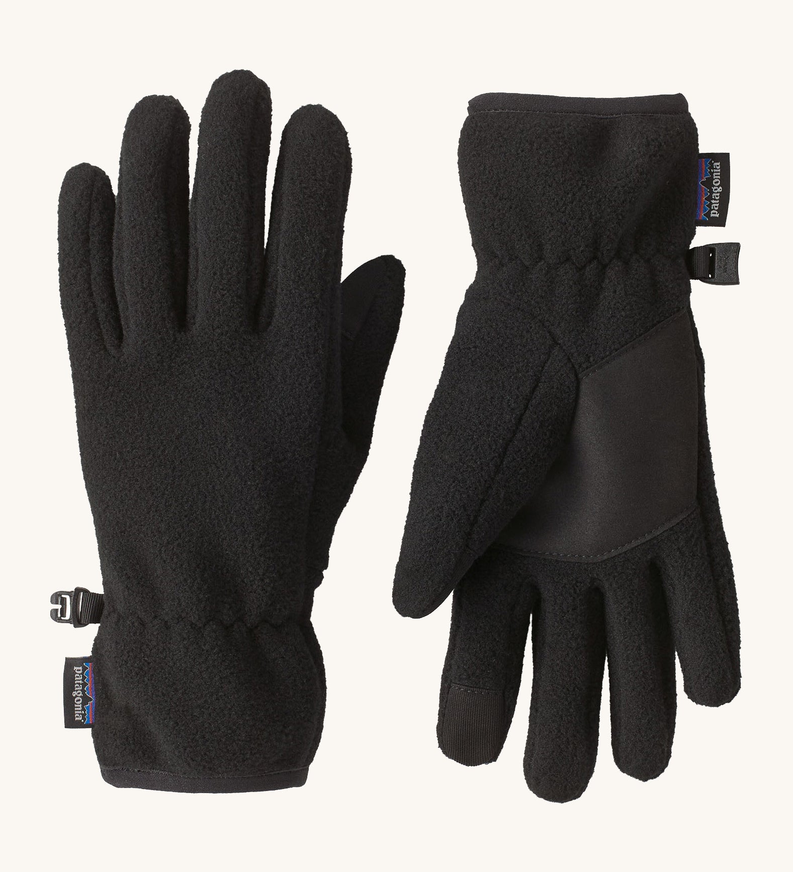 Patagonia kids synchilla gloves. A pair of solid black light fleece fabric gloves, features a grip panel on the palm, thumb and index finger.   Logo patch stitched on the wrist cuff.