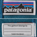 A close up of the name label and brand patch that's stitched on the Patagonia kids synchilla fleece.