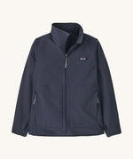 Patagonia kids tech face jacket in a navy  colour on a cream background.