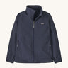 Patagonia kids tech face jacket in a navy  colour on a cream background.