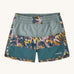 Patagonia kids swim shorts in blue and green colour block on a cream background