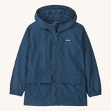 Patagonia kids outdoor everyday jacket in a dark blue colour on a cream background.