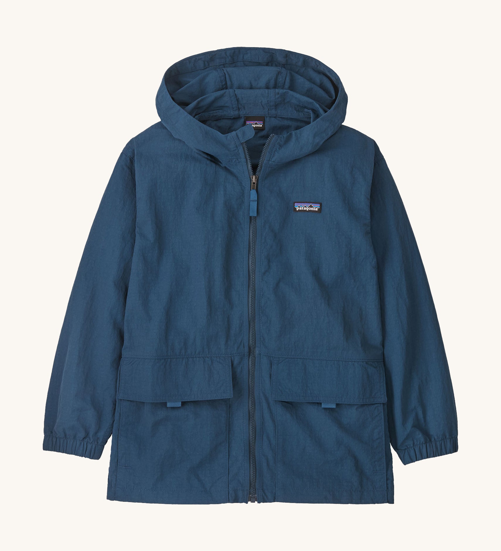 Patagonia kids outdoor everyday jacket in a dark blue colour on a cream background.