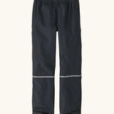 Back of the Patagonia kids waterproof torrentshell 3L rain pants in black. Reflective band around the shins.