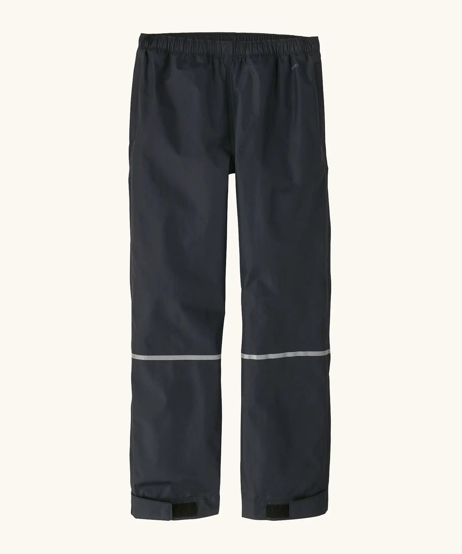 Back of the Patagonia kids waterproof torrentshell 3L rain pants in black. Reflective band around the shins.