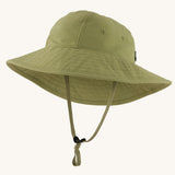 The Patagonia Kid's Trim Brim Sun Hat in green. Showing air holes on the side panel and adjustable chin strap