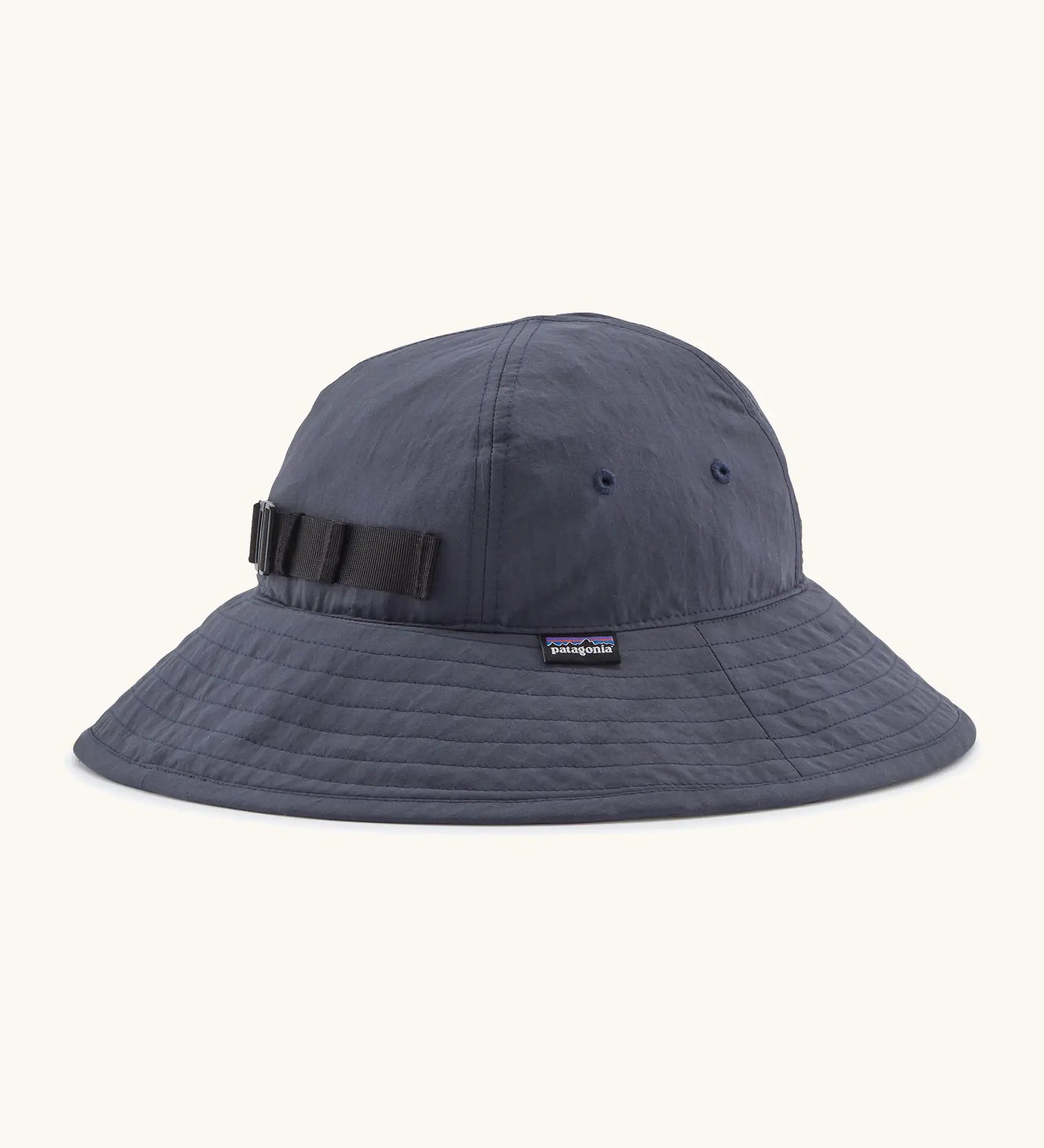 Patagonia kids recycled nylon wide brim sun hat in navy showing air holes on the side and elasticated size strap on the back