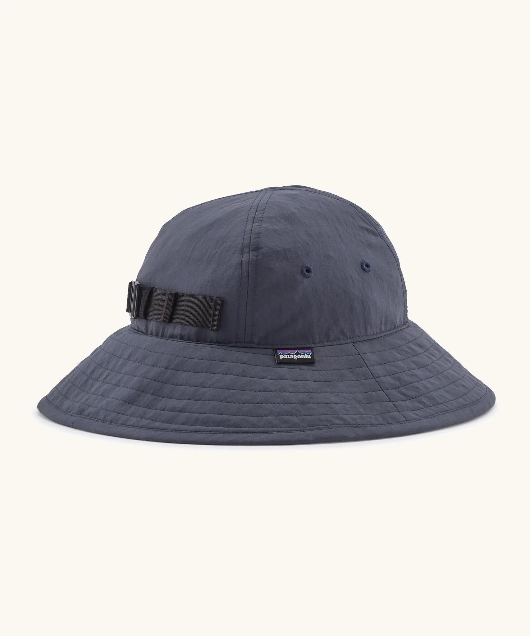 Patagonia kids recycled nylon wide brim sun hat in navy showing air holes on the side and elasticated size strap on the back