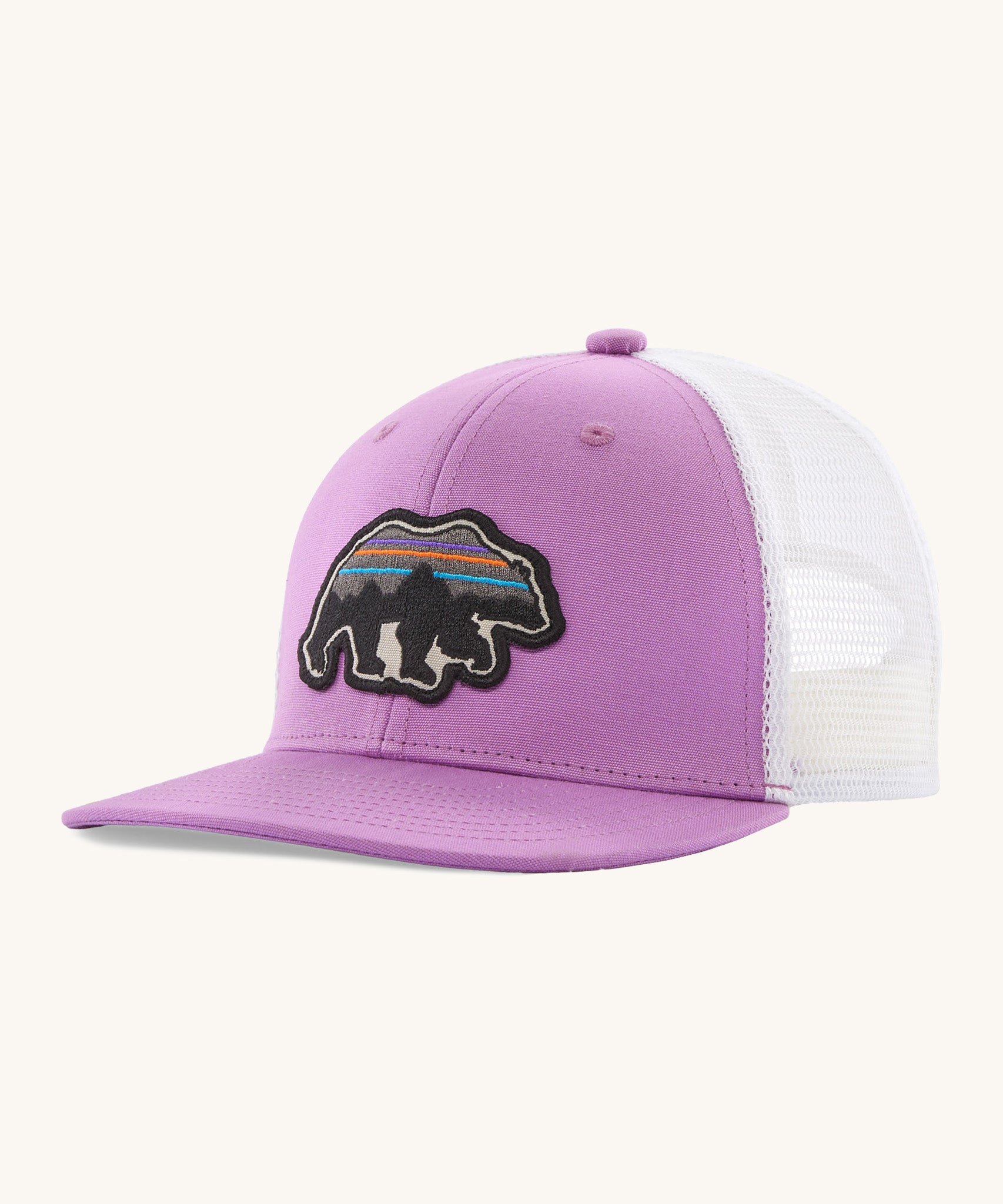 Patagonia kids trucker hat in back for good bear/ brisk purple. Showing the vibrant purple front panel and matching bill, white mesh on the back. Features a brand patch on the front panel in a shape of a bear