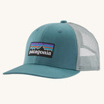 Patagonia Kids Trucker Hat Baseball Cap in a P-6 Logo and Wetland Blue design on a plain background.
