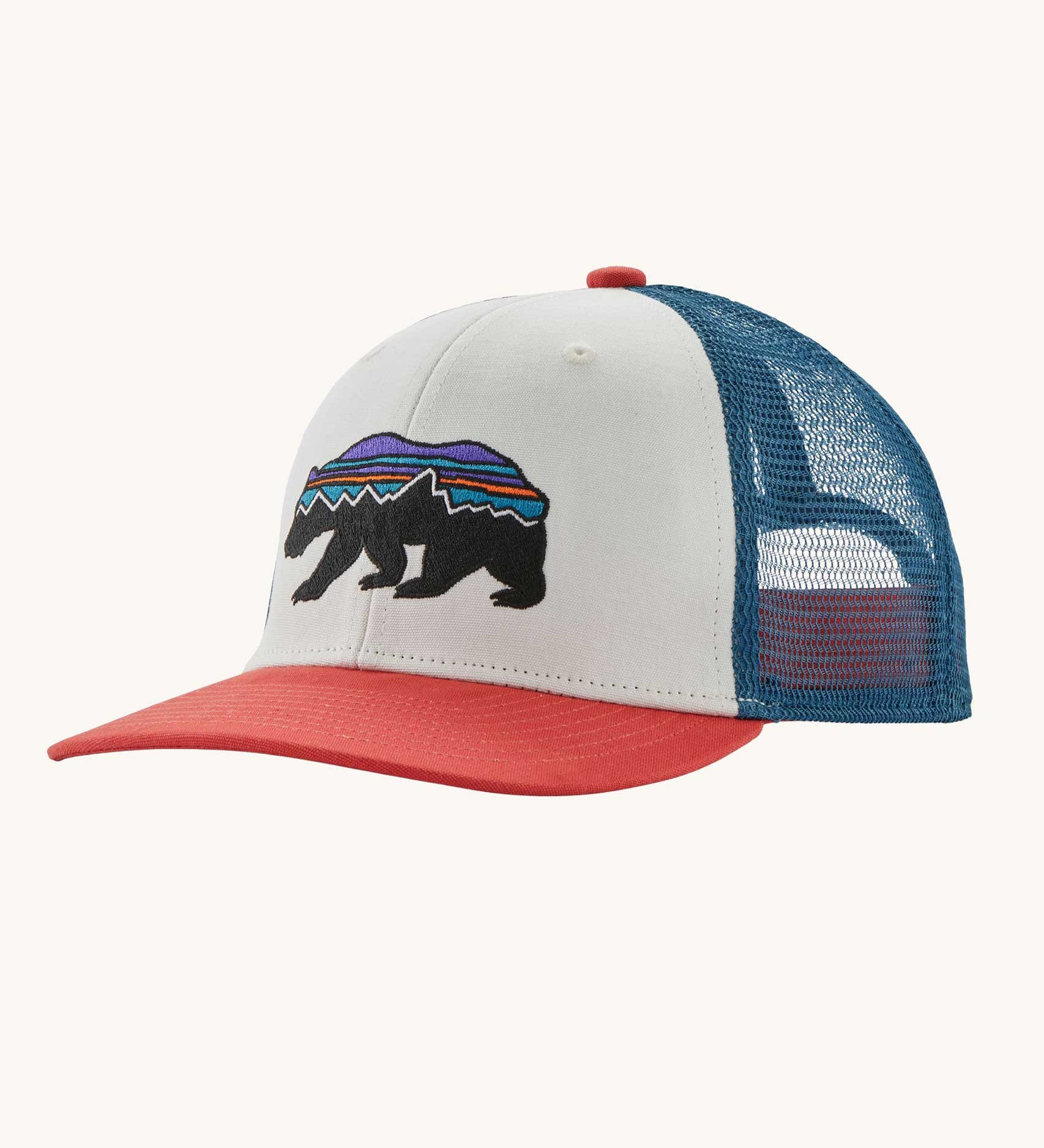 Patagonia kid's trucker hat in birch white with a fitz roy bear on the front, red visor and a navy netting on the back. 