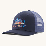 Patagonia kids trucker hat in fitz Roy foliage / new navy. Showing the navy blue  front panel and matching bill, pastel blue mesh on the back  Features a brand patch on the front panel.