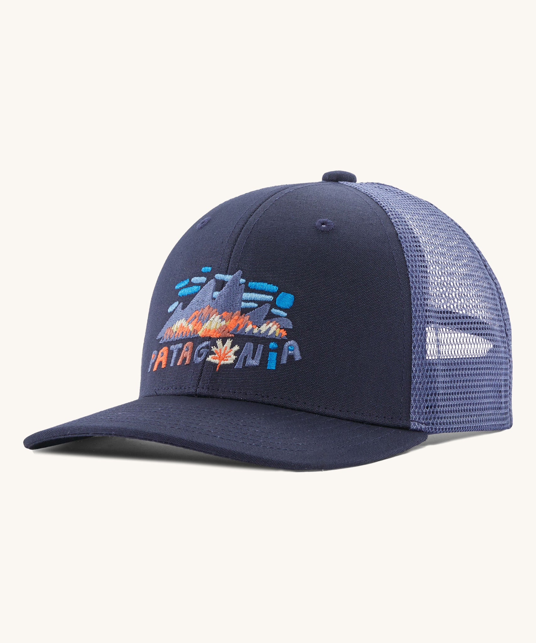 Patagonia kids trucker hat in fitz Roy foliage / new navy. Showing the navy blue  front panel and matching bill, pastel blue mesh on the back  Features a brand patch on the front panel.