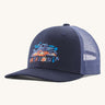 Patagonia kids trucker hat in fitz Roy foliage / new navy. Showing the navy blue  front panel and matching bill, pastel blue mesh on the back  Features a brand patch on the front panel.