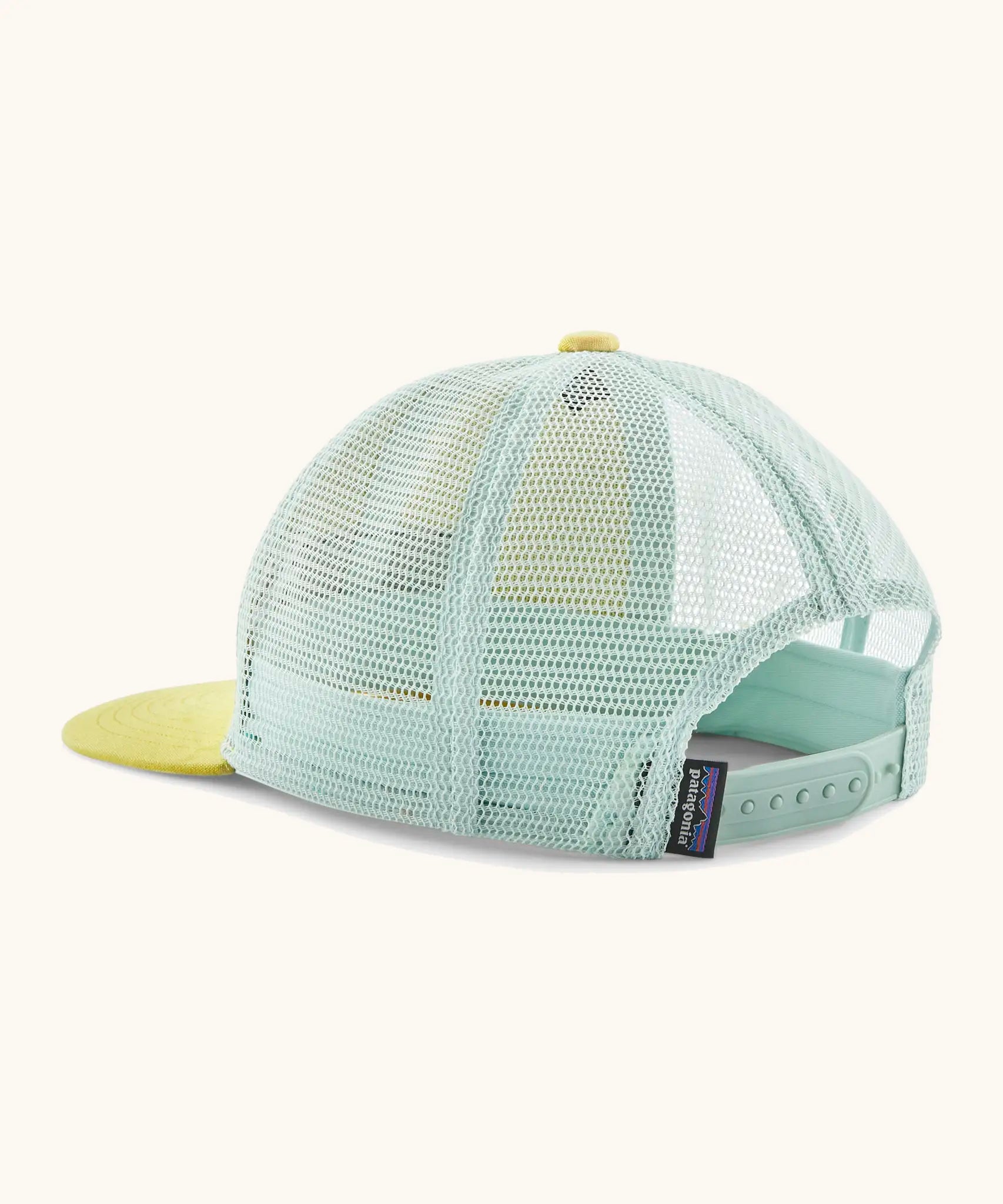 Patagonia kid's trucker hat in lemon zest yellow showing mind green mesh back panel and size adjustment strap
