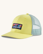 Patagonia kid's trucker hat in lemon zest yellow with boardshort logo on the front and mint green netting on the back. 