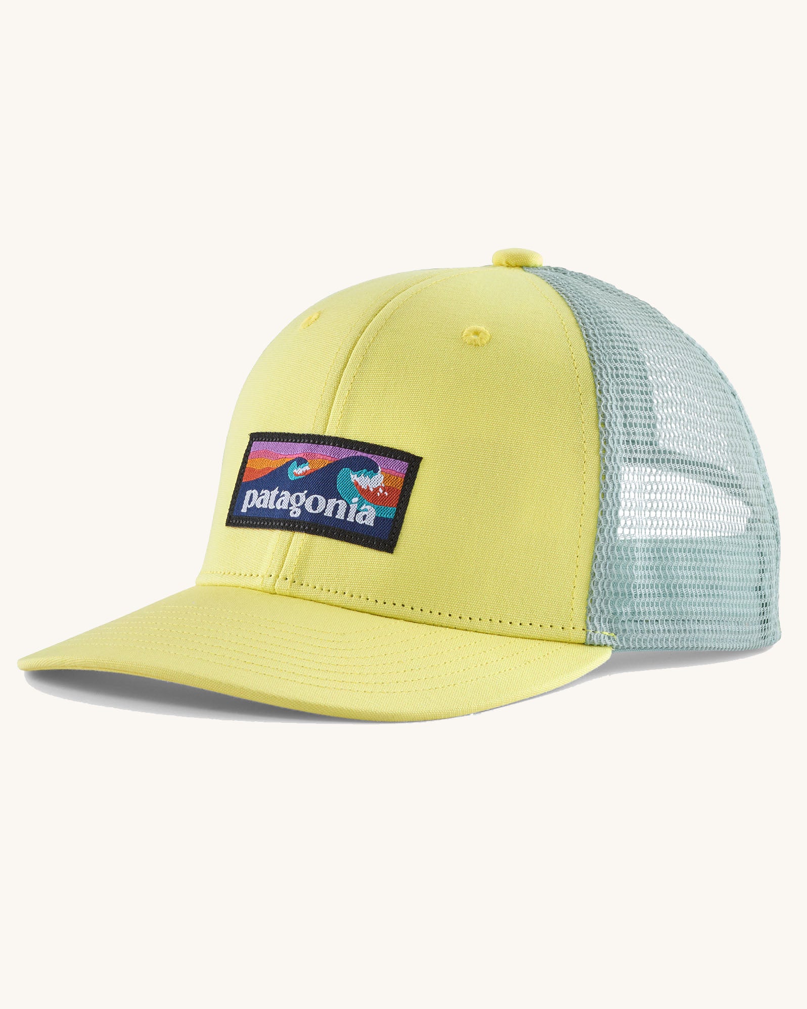 Patagonia kid's trucker hat in lemon zest yellow with boardshort logo on the front and mint green netting on the back. 