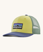 Patagonia kids trucker hat in nearly green Showing the pale green front panel, pastel green mesh on the back and a blue bill. Features a brand patch on the front panel.