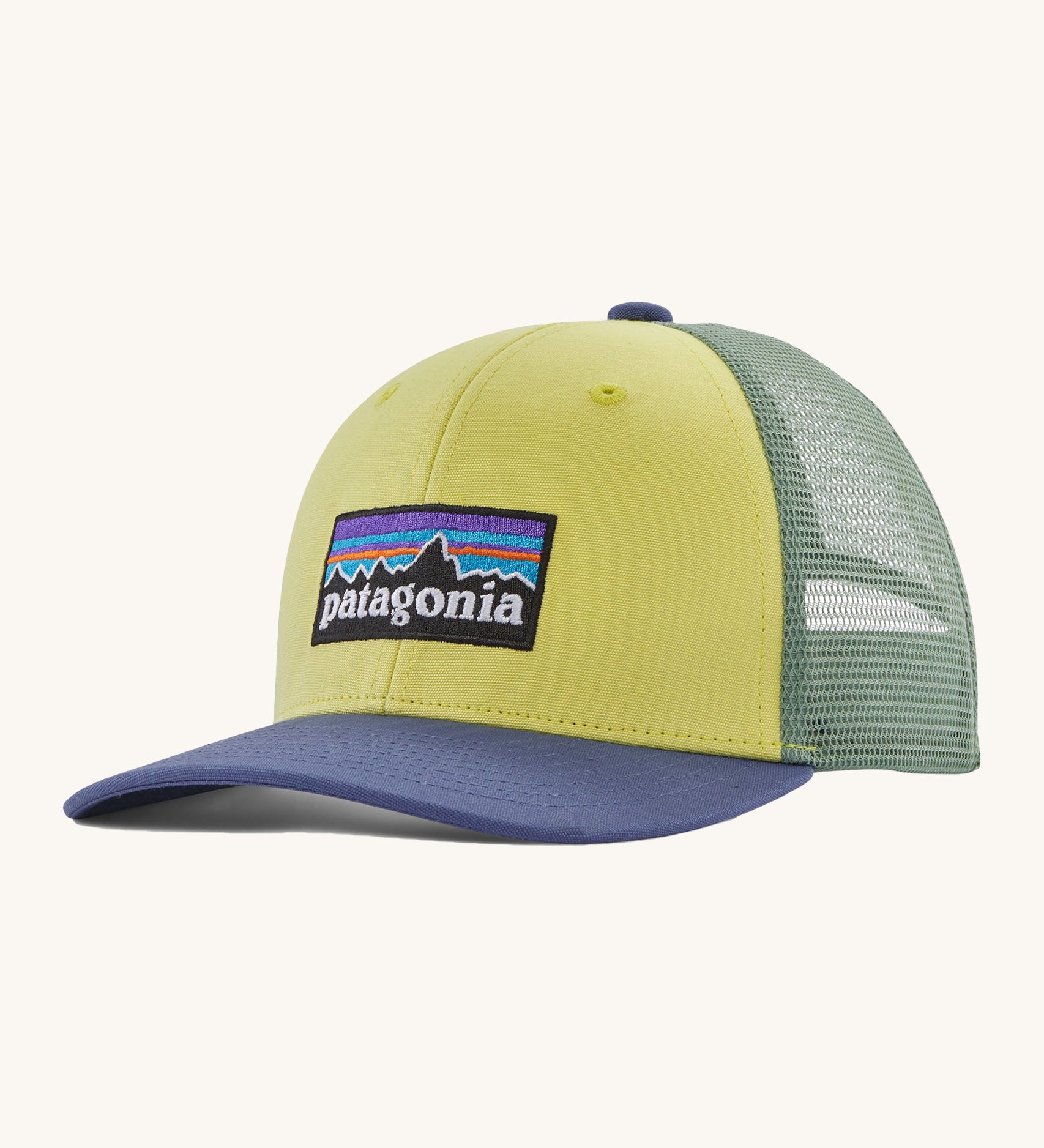 Patagonia kids trucker hat in nearly green Showing the pale green front panel, pastel green mesh on the back and a blue bill. Features a brand patch on the front panel.