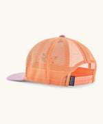 Patagonia kid's trucker hat in purple with peach orange mesh on the back. Showing adjustable size strap
