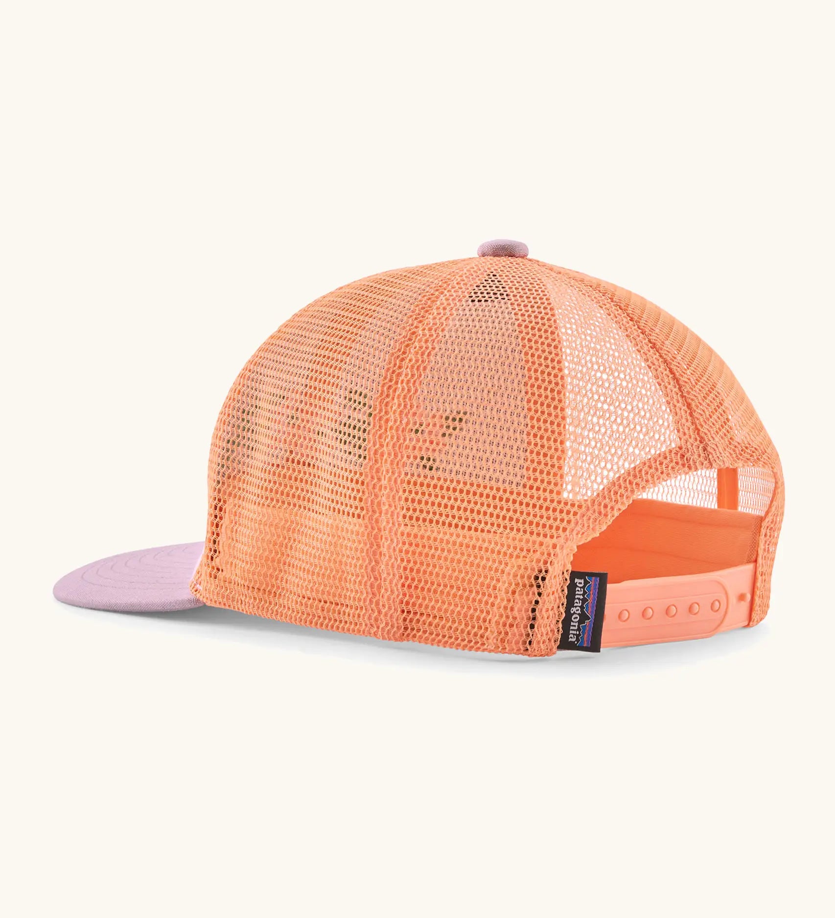 Patagonia kid's trucker hat in purple with peach orange mesh on the back. Showing adjustable size strap