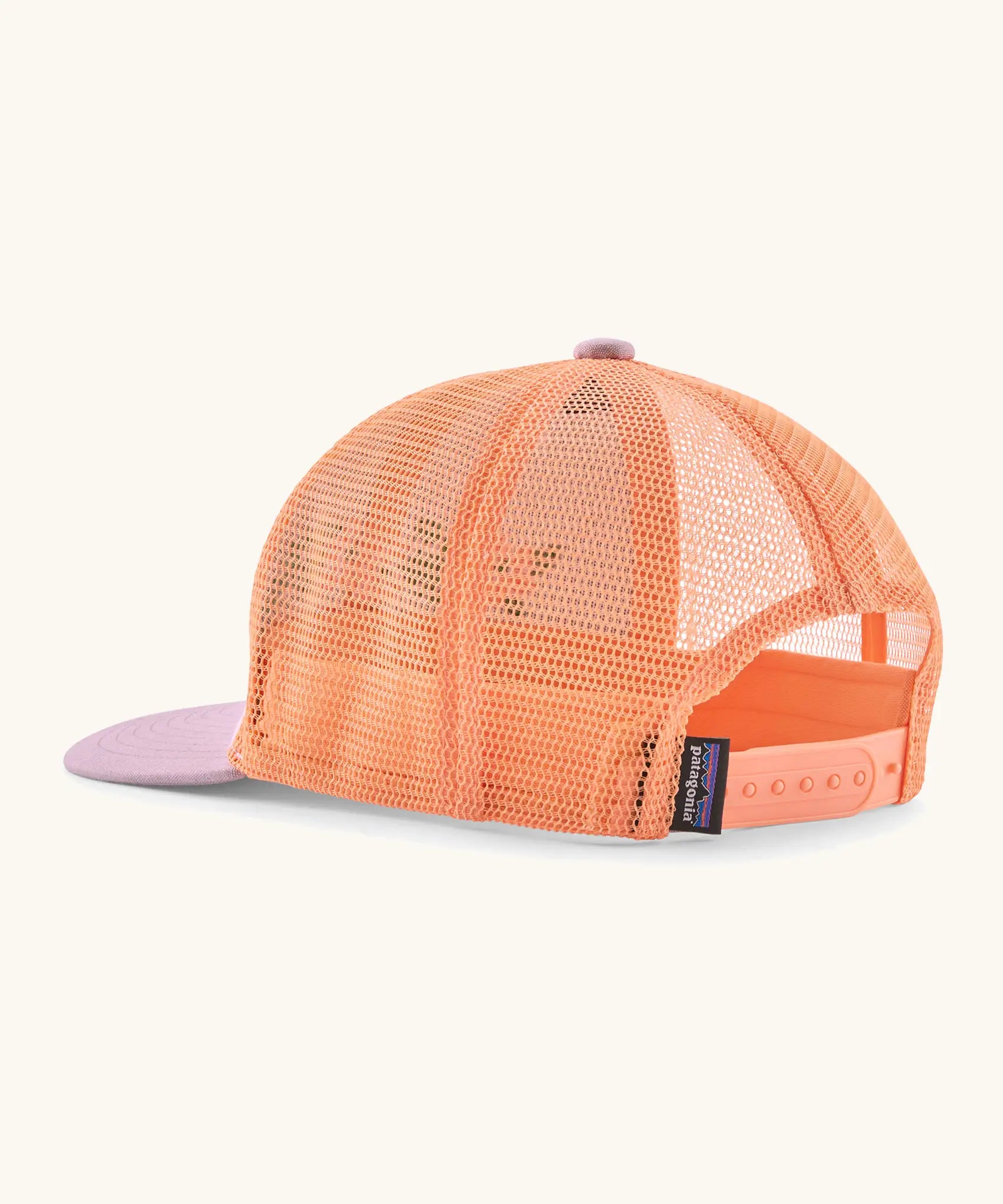 Patagonia kid's trucker hat in purple with peach orange mesh on the back. Showing adjustable size strap