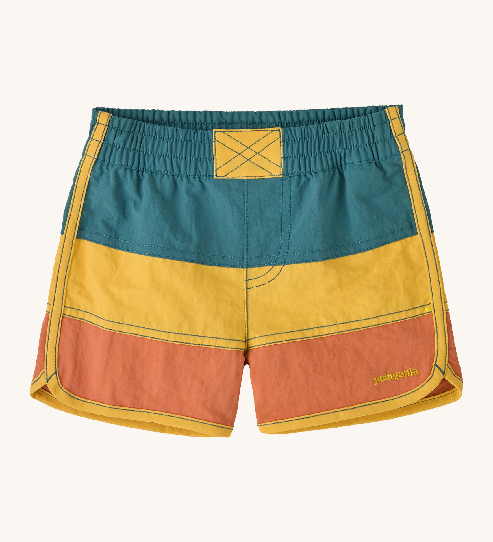 Patagonia kids swim shorts in blue yellow and orange colour block on a cream background