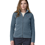A woman wearing a Patagonia Women's Better Sweater Jacket Utility Blue stood in front of a plain background