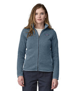 A woman wearing a Patagonia Women's Better Sweater Jacket Utility Blue stood in front of a plain background