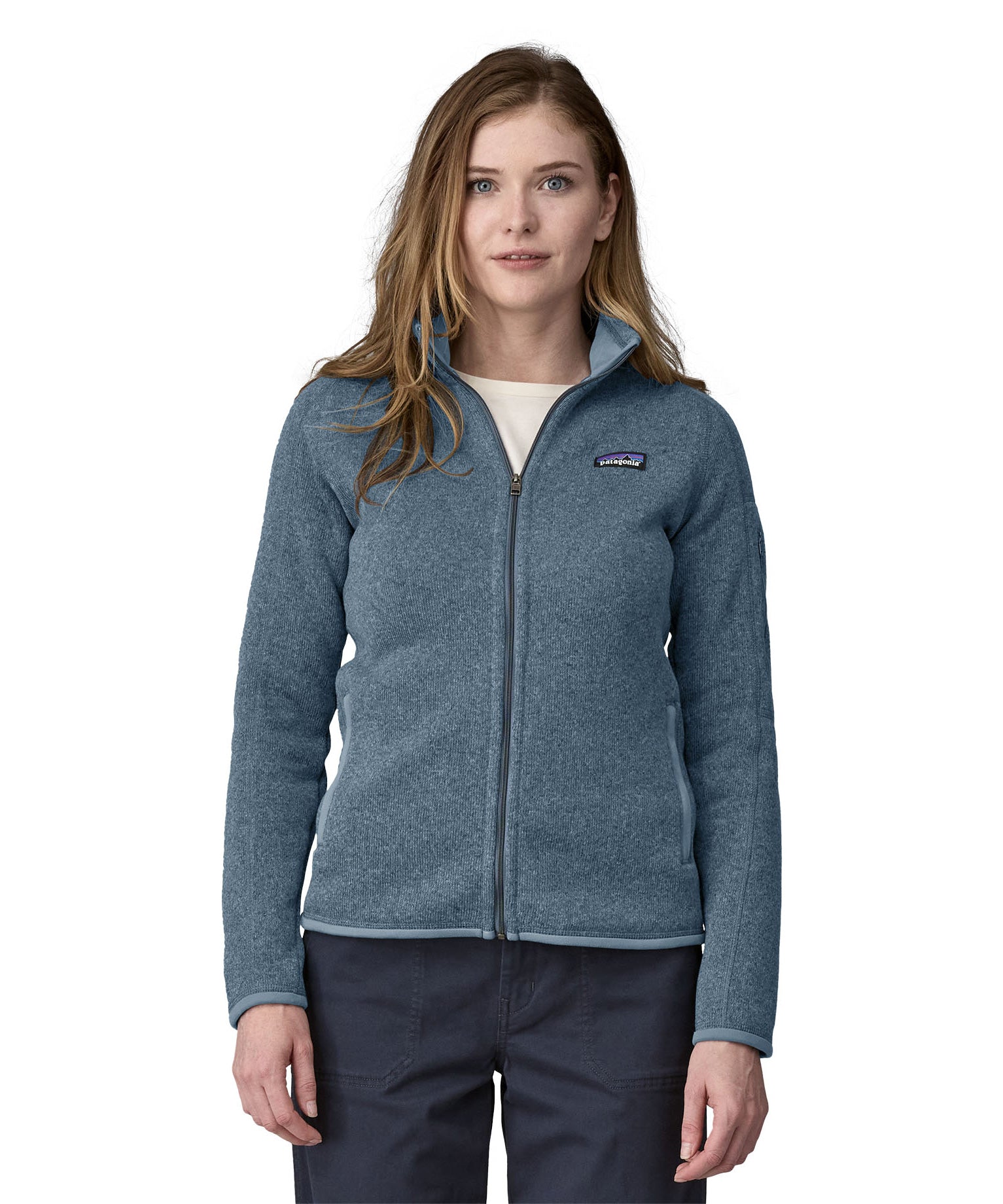 A woman wearing a Patagonia Women's Better Sweater Jacket Utility Blue stood in front of a plain background