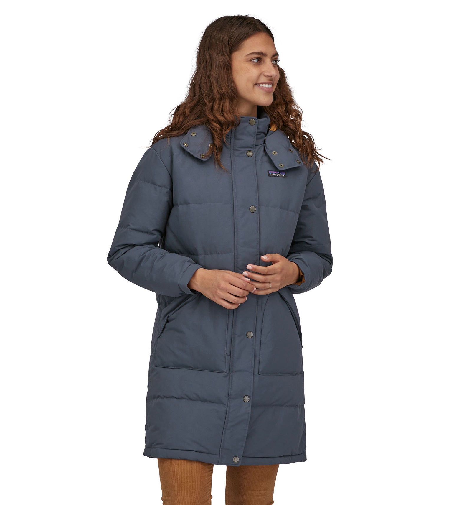 A woman wearing a Patagonia Women's Downdrift Parka Pine Smolder Blue