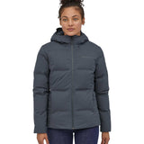 A woman wearing the Patagonia Women's Jackson Glacier Jacket in a Smolder Blue colour.