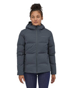 A woman wearing the Patagonia Women's Jackson Glacier Jacket in a Smolder Blue colour.
