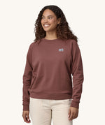 A woman wearing the Patagonia Women's Regenerative Cotton Essential Top in a Dulse Mauve colour.