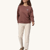 A woman wearing the Patagonia Women's Regenerative Cotton Essential Top in a Dulse Mauve colour.