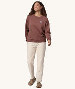 A woman wearing the Patagonia Women's Regenerative Cotton Essential Top in a Dulse Mauve colour.