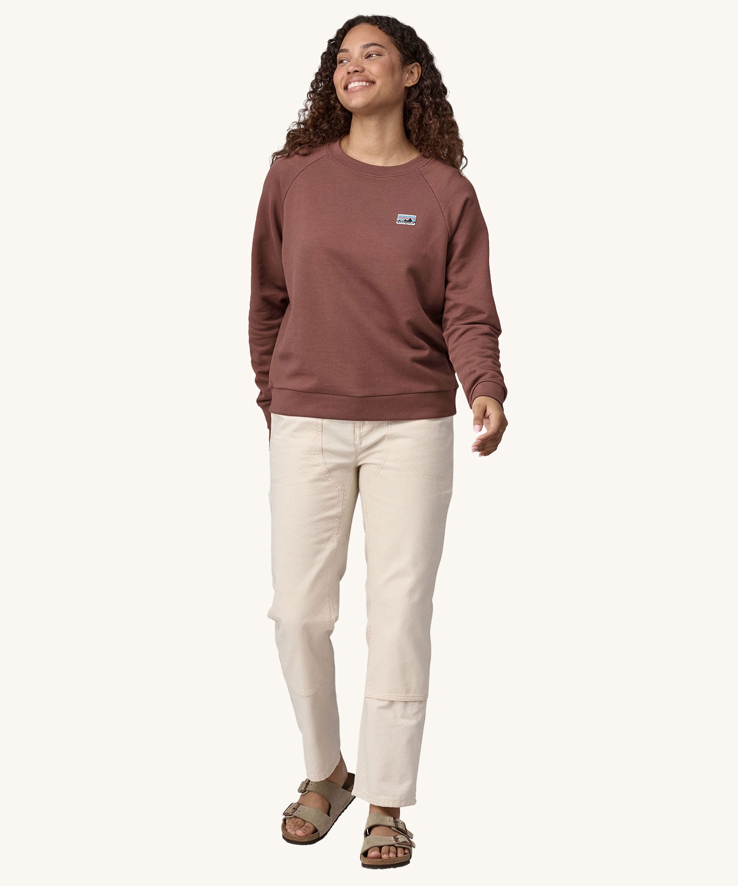 A woman wearing the Patagonia Women's Regenerative Cotton Essential Top in a Dulse Mauve colour.