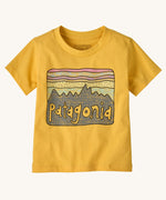 Patagonia Little Kids Regenerative Fitz Roy Skies T-Shirt in a Nectar Yellow colour way on a plain background. 