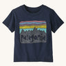 Patagonia Little Kids Fitz Roy Skies T-Shirt - New Navy. A deep, navy blue t-shirt with a fun Patagonia mountain range print in front of a striped pink, blue, purple and .yellow sky
