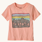 The Patagonia Little Kids Regenerative Fitz Roy Skies T-Shirt in a Sunlit Pink colour way on a plain background.