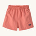 The Patagonia Little Kids Baggies Shorts in Peak Pink colour way on a plain background. 
