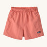 The Patagonia Little Kids Baggies Shorts in Peak Pink colour way on a plain background. 