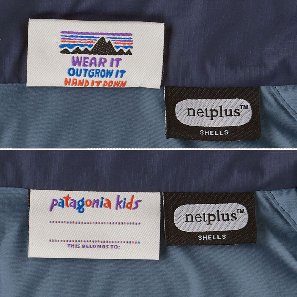 The details on the Patagonia Little Kids Down Sweater ID label. One side has a place to write a name and the other side has the Patagonia mountains emblem along with the words wear it, outgrow it and hand it down written underneath. 
