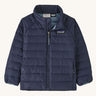 The Patagonia Little Kids Down Sweater kids jacket in a New Navy colour on plain background. 