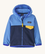 A Patagonia Little Kids Micro D Snap-T Jacket in a new navy abundant blue colour way on a plain background. 