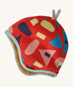 Patagonia little kids in forest being and sizzle red design. A reversible hat which features a red beanie with different coloured shapes and grey decorative tabs on top and brown fur on the inside to keep the head and ears warm. 
