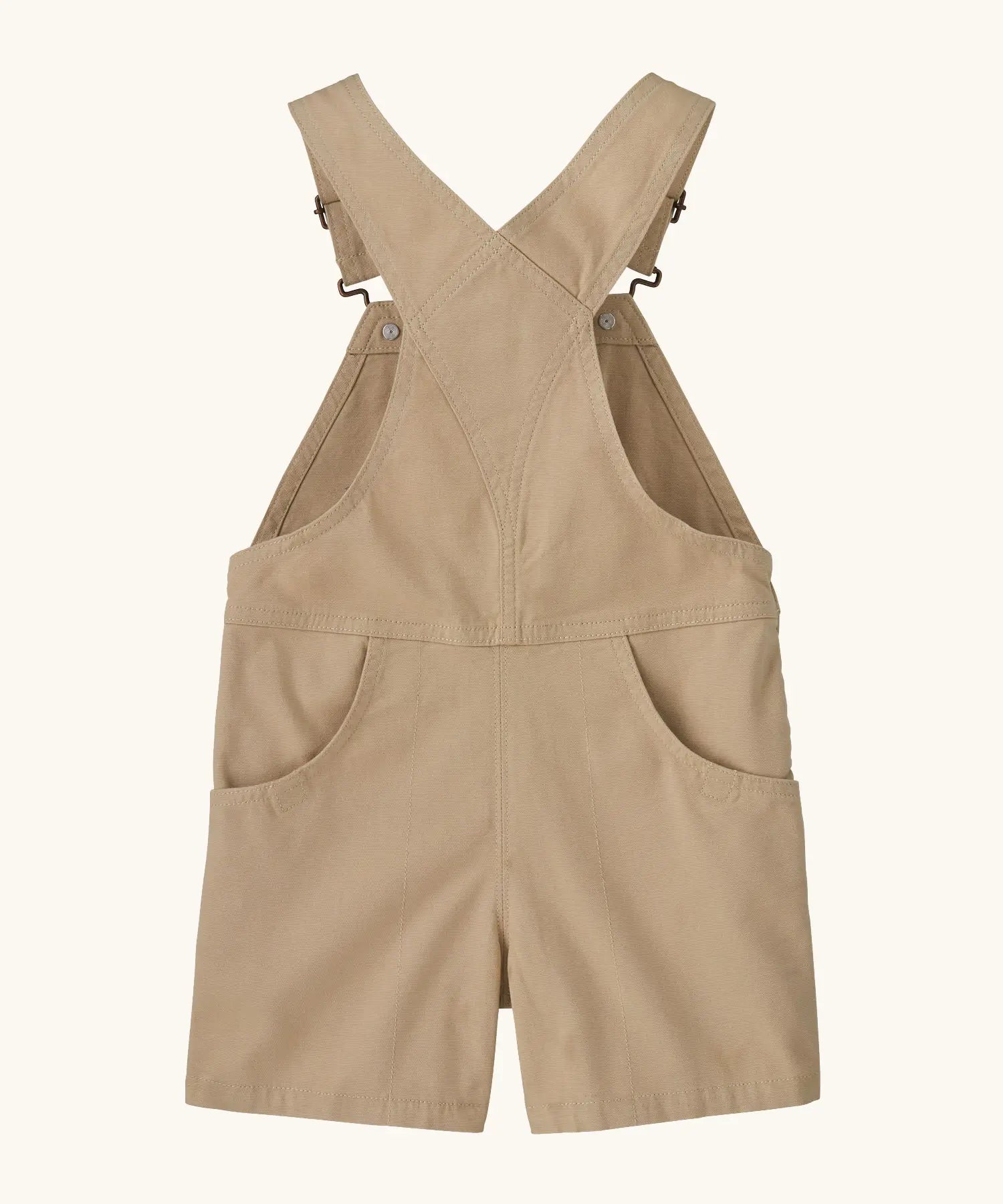 Patagonia Little Kids Stand Up Shortall dungarees in an dark cream showing back pockets and crossed shoulder straps
