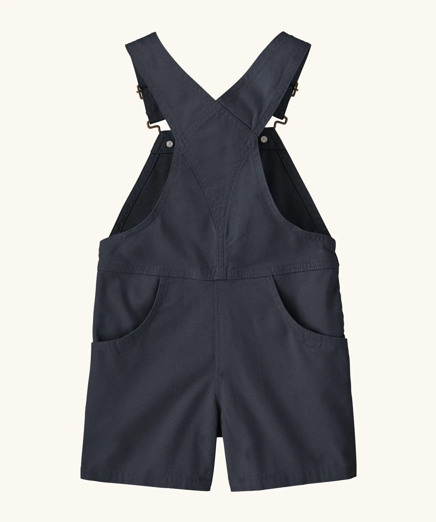Patagonia Little Kids Stand Up Shortall dungarees in an navy showing small pockets and crossed shoulder straps